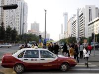 Car, crosswalk, and buildings