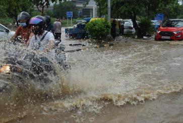 Motorcycle on flooded street. Sudarshan Jha/Shutterstock