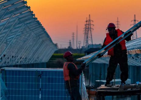 men installing solar panels in China